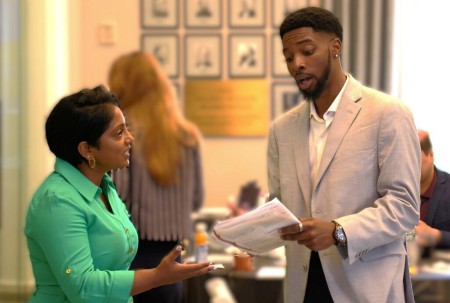 A speaker and leader having a discussion in the APhA board room